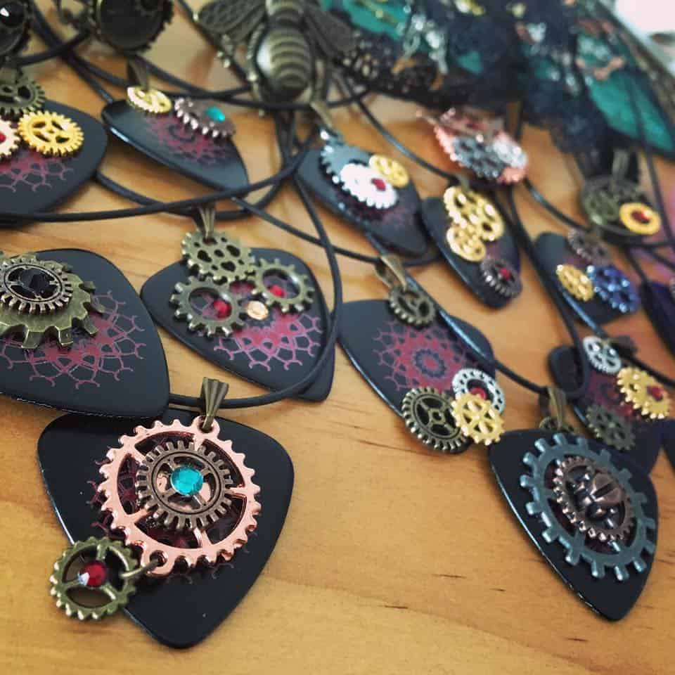 These steampunk guitar pick necklaces are amongst the accessories that Sangriento sells at their shows.