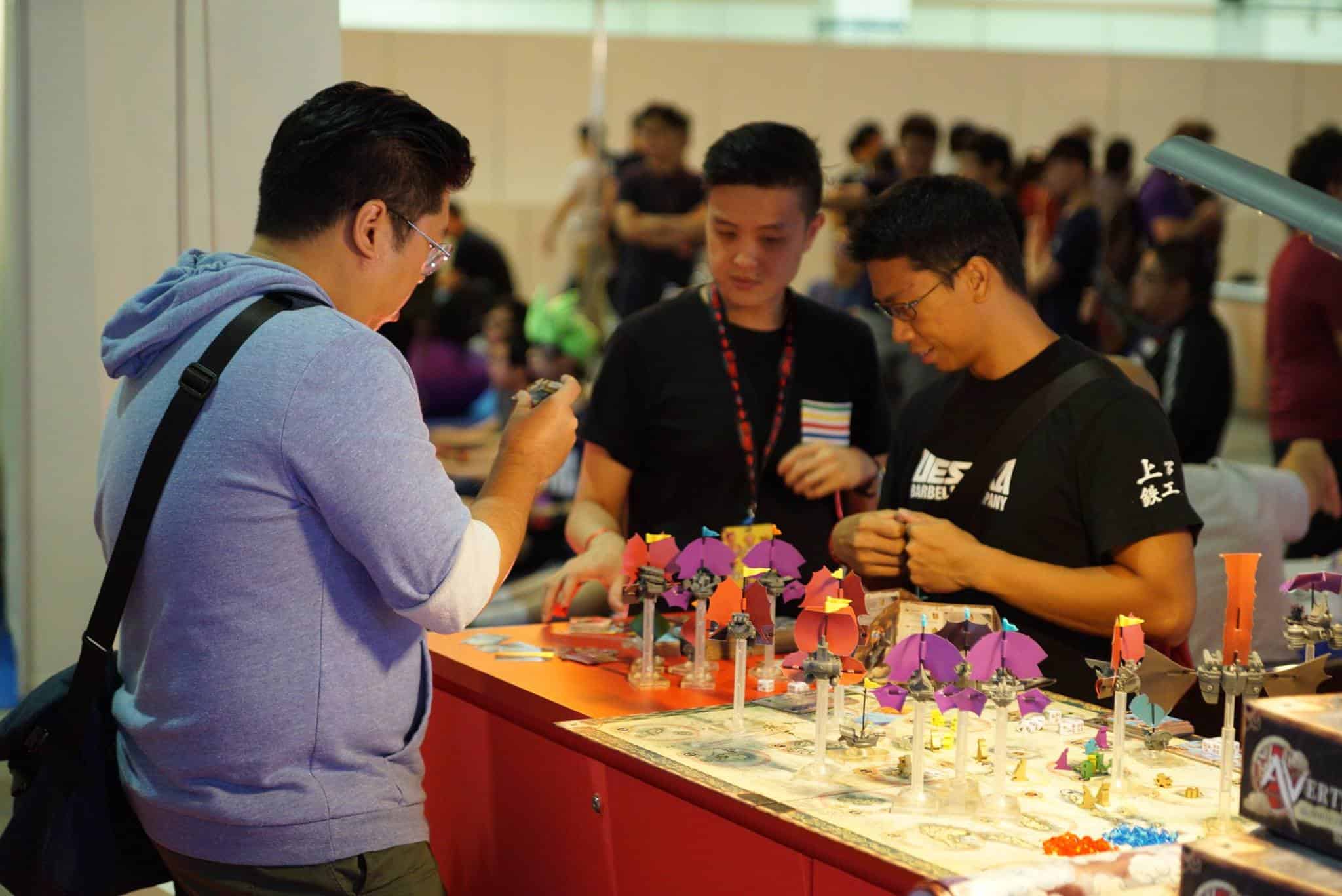 People checking out Avertigos at Singapore Toy, Game and Comic Convention. Source.