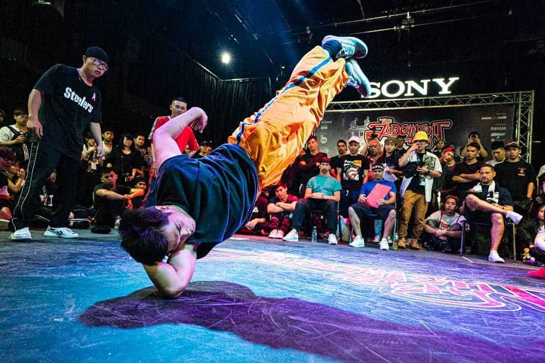 Breakdancer male on elbow in dance battle